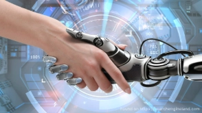 a human hand shaking a robots hand